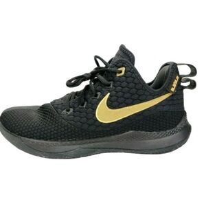 - Black Nike Air Gold sneakers
